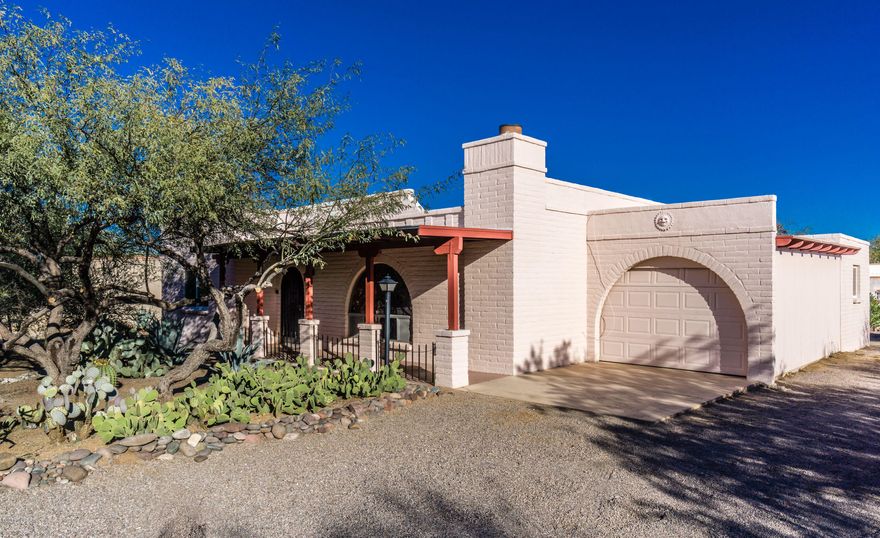 A free standing home located in desirable La Canada Desert homes with an abundance of trees and desert vegetation . All tiled floors throughout in southwest colors with a living room fireplace.