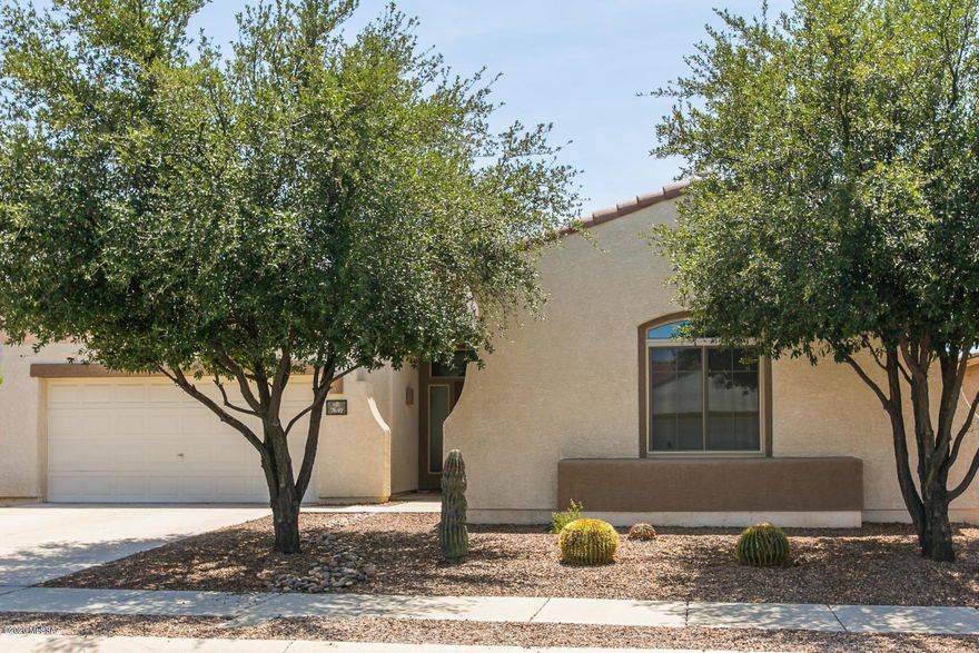 This 4 bedroom home boasts of upgrades. Granite counters , new tile Stainless appliances, bay window, ceiling fans, security doors and more. Enjoy NW Tucson in of the community pools or recreation at one of the parks.