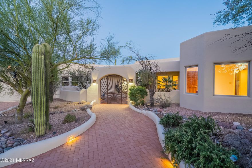 Stunning southwestern style Ron Robinette custom home w/ endless views on 5 acres in a private gated area. Perched above the Tucson valley you are wrapped w/ views of the Tucson Mountains, city lights, canyons & Saguaro National Park. Enter through a courtyard w/ copper fountain & inside you will love the high ceilings & abundant wood windows. Updated kitchen w/ granite, high end SS appliances, double ovens & gas cook-top. A mix of Saltillo tile floors & wood, the ONLY carpet in the home theater.  Totally updated technology for the best theater experience you can have in your own home! An entertainer's dream with so many patio's, porches and decks to enjoy the views & Tucson weather.  4 car garage & OWNED WHOLE HOUSE SOLAR SYSTEM! New exterior paint 11-21, roof re-coated 10-21. No HOA. Door locks, lights, thermostat, solar can all be controlled and monitored via an app for easy home automation.
TWO new HVAC units in '18 and '19.