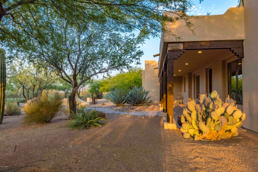 Private secluded Hacienda with a contemporary touch, nested in the heart of Oro Valley, brings to life the elegance and spirit of Classic Old Tucson with 5,274 sq ft of living/lifestyle space. Main house has 3451 sq ft, 3BR/4BA & office + 1823 sq ft 1BR/1BA Casita with media room, office & entertaining space. Over-sized 5 car garage w/epoxy floors for the car aficionado. Surrounded by lush mesquite trees and saguaros, the property features outdoor living area w/BBQ grill, gas fireplace & rooftop viewing area accessed via spiral staircase. Lovely gourmet kitchen features granite counter top, cherry cabinets & walk-in butler’s pantry. Concrete flooring, 8 ft. solid alder doors & Pella wood encased triple pane windows. Bedrooms feature private baths and patios. *Please see addition remarks. Rainwater collection system - 5,000 gal. underground storage tanks with pump connected to drip irrigation system - Less than 1 inch of rain required to fully recharge rainwater system.
-Three on-demand gas water heaters supply hot water to the house
-Tiered media room with 70 inch flat screen TV & surround sound system included
-Built-in 36 inch Twin Peaks gas grill with rotisserie and smoker
-Intercom system to connect guest house to main house
-Casita BR/BA/OFFICE are Wheel Chair Accessible.