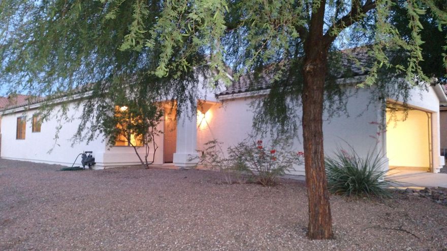 Beautifully perched corner lot(3bdr/2bth), with rear yard vista views of the Santa Ritas. Interior completely  up grade from new porcelain plank tile, new carpet, new 2 toned paint,window treatments/blinds,new light fixers,refinished cabinets and trim,epoexyed garage floor,new exterior paint, brick paved exterior patio with fireplace.