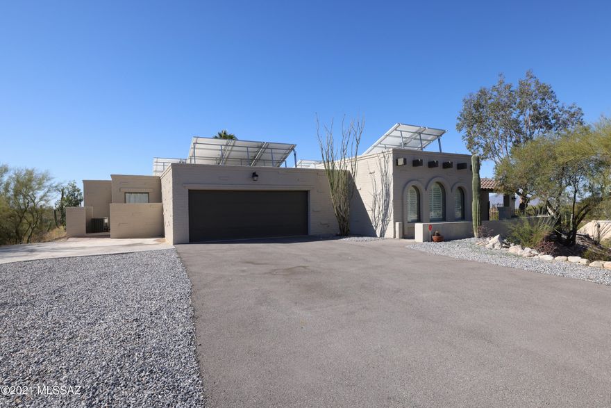 This recently updated foothills home on 1.22 acres offers any amenity a scrupulous buyer could want. Every window in the home boasts either mountain or city views. Convenient shopping and dining at La Encantada is within walking distance. The 2019 modern-style remodel includes a new driveway with plenty of parking space, two new HVAC units, updated kitchen with calacatta counters, large laundry room addition, new interior and exterior paint, and much more. The spa-like master bathroom contains dual floating vanities, a sunken tub with a view and an additional walk-in rain shower. You will not want to miss the sweeping valley view from the backyard pool area at this hilltop home. The solar panels are owned and yield a shockingly low monthly electric bill.