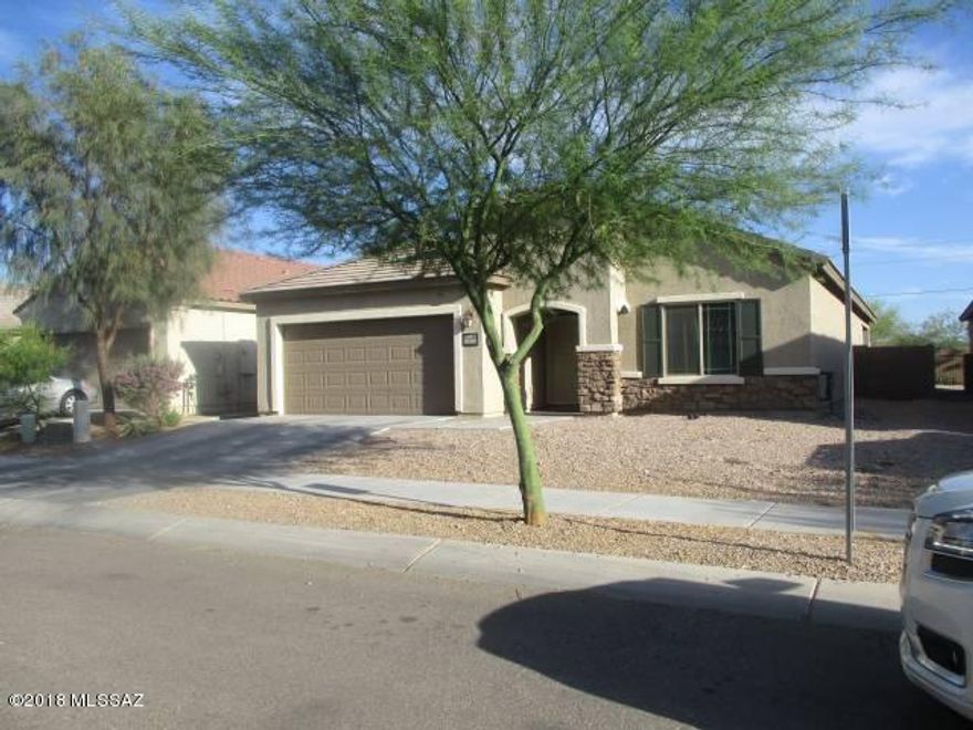4 bedrooms, 2 bath, no rear neighbors lot w/ covered patio, Italian brick pavers & views. Gourmet Chef's kitchen, 42'' cabinets, crown molding, dove-tail soft closing drawers, pull out, built in cutting board, Stainless appliances & walk-in pantry, bay window in the master suite w/upgraded cabinets, glass block, garden tub, separate shower and walk-in closet, Stone front, ceilings fans, huge laundry w/cabinets. Lovely covered patio Sparkling pool & hot tub for your summer enjoyment.  Artificial turf for low maintenance, extra storage shed.  Vail schools, shopping & dining only minutes away. Separate dog yard & doggie door.