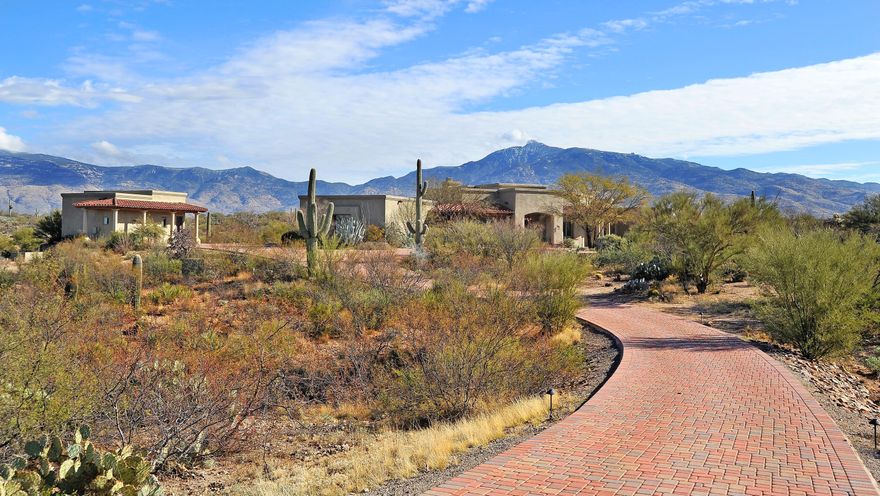 Sensational is not Good Enough to Describe this Home ... Heaven is more Appropriate. Seller started with a Gorgeous Home & Improved it. $160,000 in Upgrades Include Brick Pavers from Street to House, Beautiful Pool & Concrete Patio, Wrought Iron Fencing around Entire Property, Landscaping and Exterior Painting. Outside Offers Stunning 360* Mountain Views, & a Wrap Around Covered Patio Covering the Length of Home. Inside is even more Impressive...Views From EVERY Window, Travertine and Wood Flooring, 10 Skylights, Coved Ceilings, Alder Wood Doors Thru-out, Gorgeous Granite in Kitchen & ALL Bathrooms, Cherry Wood Cabinets, Dacor Appliances Inc. a Six Burner Commercial Stove (w/Spaghetti Faucet). Each BR has its own Bathroom, and Guest House Offers Stained Concrete Floors & of Course, VIEWS!!