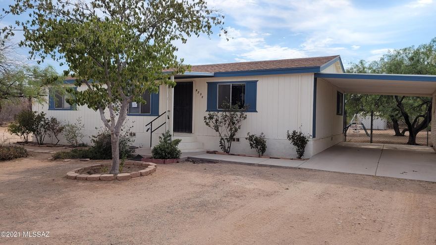 Improved manufactured home on a large lot.