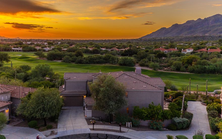 Wow! Absolute stunner located at the top of a cul-de-sac street in La Paloma. Overlooking Canyon 1 Fairway, with a gorgeous mountain backdrop, you'll never want to leave the balcony. Kitchen appliances are less than 5 years old. Enjoy the immaculate hardwood floors throughout stairs and upstairs breezeway. Stepping into the cushioned carpet bedrooms, you'll see surround sound built-in to the media room upstairs. Custom wood plantation shutters throughout with a lifetime warranty. Cozy up by the fire, either outside or in the family room. Soaring ceilings greet you, with large windows for extended mountain views. NEW HVAC 7/2018. New garage door motor 07/2018. All you need to do is bring your furniture *unless you want some of the existing*! Buyer to verify all facts+figs, incl those in MLS