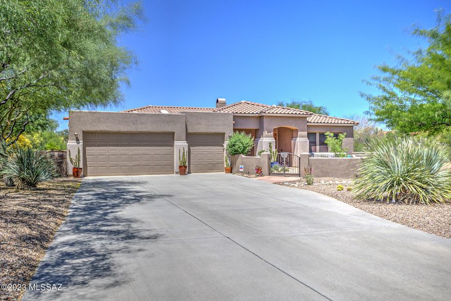 You don't want to miss this well-appointed AF Sterling home in the heart of Oro Valley on private cul-de-sac across from the community park. This prestigious, gated community offers luxury and beauty at first glance with a walk through the courtyard entry. Open, gourmet kitchen boasts 42'' cherry cabinets, granite slab counters, SS appliances, and a breakfast bar. Home features a split floor plan, spacious primary suite that includes a newly renovated bath w/ dual vanities, walk-in shower, separate commode room and WIC. Guest ensuite w/ shower and quartz countertops welcomes family or friends. The kitchen overlooks the spacious great room w/ entertainment center. and cozy fireplace for those cool, Tucson evenings. The dining nook leads to your backyard paradise. Enjoy north facing... 67 ac. lot w/ stunning views of the Catalinas to the east. Wonderful outdoor entertaining area w/ built-in BBQ grill, wood burning fireplace, paver patio, banco seating, surrounded by a lovely landscape. Welcome home!