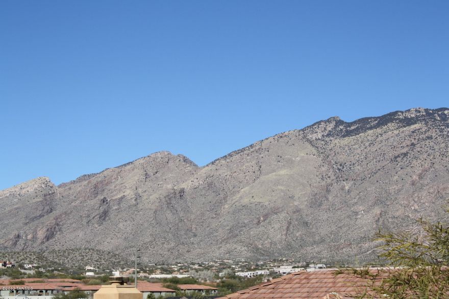 Private 1BD/1BA Catalina Foothills condo in the gated community of Pinnacle Canyon.  Breathtaking mountain views from your 2nd floor patio!  This spacious condo features covered patio, open kitchen with pantry and bar area, high ceilings, full bathroom, master bedroom with walk-in closet, washer & dryer included, utility closet for storage and a great room plan with dining area and living room & fireplace.  The Pinnacle Canyon Condos resort style amenities include heated pool & spa, fitness center, clubhouse, bbq areas, park-like grounds and a convenient Foothills location within walking distance to shopping, restaurants and Sabino Canyon Park.  You won't want to miss this one!