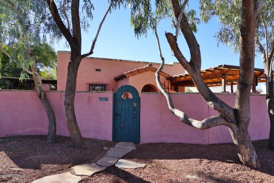 Lost Barrio Artist Retreat! Lovingly restored, well maintained Barrio San Antonio bungalow.  Beautiful custom woodwork and tile artistry.  2 bed and den, 2 bath main house.  Out door shower.  2 water harvesting cisterns.  Guest house with kitchen, bath and sleeping loft plus separate back yard and privacy.  Next door to neighborhood park, across the street from bike path. Close to downtown, U of A, bus lines and central Tucson.  Tenant in guest house pays $550/month and would be agreeable to staying.