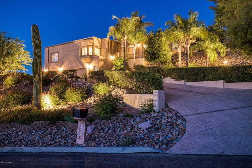 Enjoy the Oro Valley Country Club at it's finest! This remodeled, very private hillside Mediterranean home has sprawling views of the Oro Valley CC golf course, Catalina and Tortolita Mountains! Enjoy the wide open chefs kitchen with all the amenities needed to prepare a restaurant inspired feast including a wine fridge, double sink with two faucets, double oven with convection, subzero fridge and massive center island. Enjoy the views from your multiple patios including a private veranda off of the master suite and front entry sanctuary patio. The rear backyard and covered flagstone patio include a built in BBQ with burners and sink, stone scape pool and raised spa with two waterfalls, color changing LED lighting and energy efficient pump. If those aren't enough, enjoy the upper view patio to sit back and relax. The main home has been updated throughout the last 4 years with a ton of upgrades and finishes and there are too many to list but some to include are travertine floors, entire home painted inside and out, kitchen and appliance upgrades, new master bathroom, new window coverings including power black out blinds in the master, pool and spa redone in stone scape, freshly coated roof and much more! The oversized three car garage is fitted with built in cabinets, 2 storage rooms, two tone paint to match the home and freshly coated floors. This home also boasts a 805sqft guest house with a full kitchen, bath and laundry room that is perfect for extended family or vacation rental.