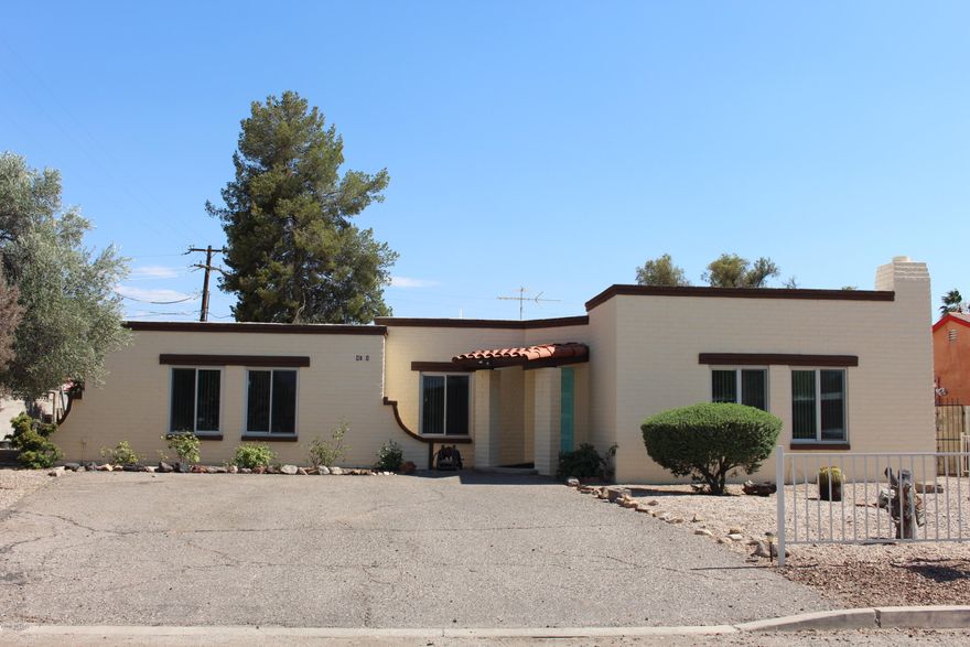 Motivated seller! Under $100per SqFt! Solid block home features 18'' ceramic tile floors.bright kitchen with skylight, large island breakfast bar, and plenty of cabinets. Master bedroom with his/her closets.Master bath has beautiful subway tile. Hall bath with bathtub and updated tile as well. Triple pane windows, new A/C and water heater make this home quiet and energy-efficient. large sized laundry room w/ sink and extra room for a hobby. Large yard with rear Large yard with rear patio and mature landscaping. Freshly painted on the outside. Convenient location is walking distance to many shopping centers & restaurants.4.8 Miles to U of A (11 min drive) & 1.8 Miles to TMC.