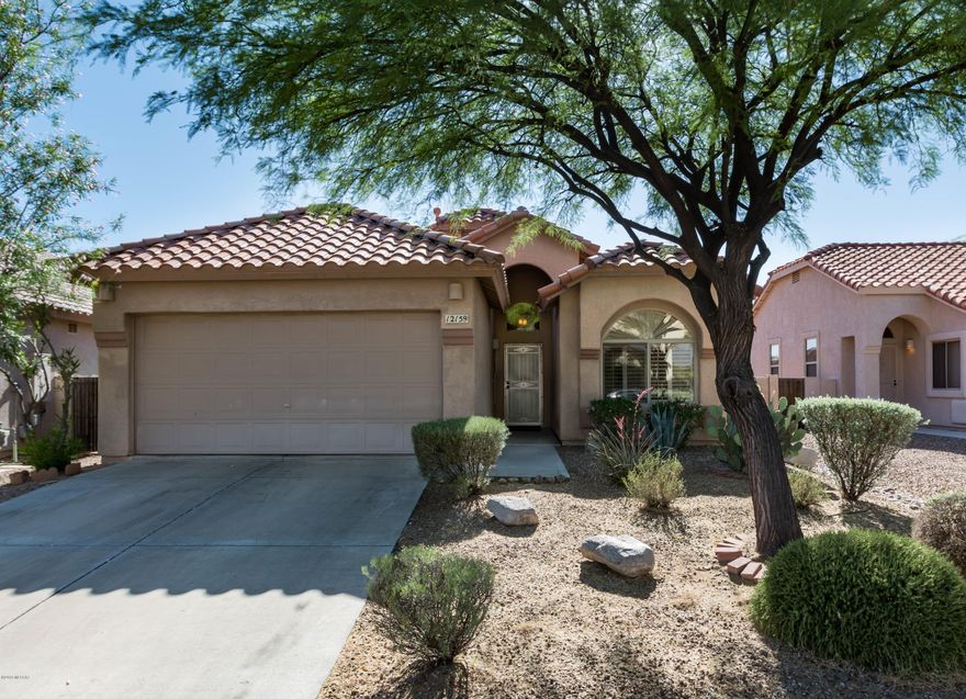 Ready to move in & enjoy! Easy care tile in entry, kitchen, family room, laundry. Upgraded lighting & fans. Galley style kitchen with granite counter tops, stainless steel appliances, very quiet Bose dishwasher, pantry. Room for table in bay window area. Glass panel doors to laundry room. One bedroom used as den with glass panel French doors & closet. Family room with sliding doors to patio & high shelves. Large master bedroom with bay windows. Master bath with dual sinks, large walk-in shower, glass paneled sliding doors to walk-in closet with built-ins. Plantation shutters through-out home. Front security door. Covered patio for outdoor living. Large backyard.