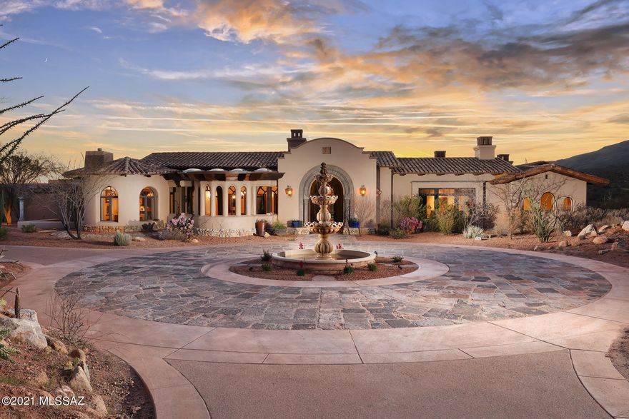 Breathtaking panoramic mountain views on the edge of Saguaro National Park on 37+ acres. ''Scottsdale meets your own private Idaho'' with endless hiking, biking and riding trails. 

Captivating main house and guest house totalling over 9,000 sq ft, designed by award winning architect, Ron Robinette. 

As you pull in, prepare to be enchanted by the serene decorative fountain and the patterned stonework roundabout. The gorgeous Cantera stone archway is complemented by Mediterranean style pillars supporting multiple patios. 

Immediately upon entering, you will be charmed by the newly enhanced courtyard, massive pool & spa seen through a collection of glass doors. The luxurious master suite showcases an elegant fireplace, private patio, sauna, yoga room, massive closets, multiple showers, massage room and/or office. 

You will absolutely love the beautiful, large, fully enhanced kitchen, luxurious media room with built in bookshelves, secret-room & heart-warming fireplace. 

A horse-lovers dream with an arena, tack room and additional facilities. Come experience the tranquil atmosphere of classic architecture in a resort-like setting. 

This is the most PRIVATE & EXCLUSIVE gated community anywhere in or directly around Tucson.