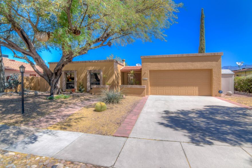 Views of the Catalinas from your backyard oasis! This gorgeous 3/2 in desirable Vista del Rio has everything you could ask for! Beautifully remodeled kitchen and bathrooms, cozy fireplace, 3 spacious bedrooms and KILLER PANORAMIC VIEWS of the mountains to the North. No neighbors directly behind. Pride of ownership is obvious everywhere you look and makes this special single story gem a MUST SEE HOME!  Close to Udall Park, shopping, restaurants, Sabino Canyon and The Loop. Backyard  is the true star with built in BBQ, hot tub, and sparkling pool surrounded by flowering bushes, trees and turf all framing the majesty of the Catalina Mountains! This home has been lovingly updated and maintained and is move in ready when you are! Blink and it will be gone!