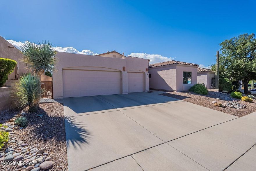 Located on the 18th Green of the Arizona National Golf Course in the gated community of Sabino Springs is the home you've been waiting for! Soaring ceilings, open floorplan, beautiful finishes, wonderful views & a spool with a relaxing waterfall for year-round enjoyment, are just a few of the special features of this property. The third bedroom is set up as an office and is next to the other guest bedroom & hall bath. The primary bedroom is located on the opposite side of the home & has a door to the beautiful backyard. The primary bath is a Zen retreat, complete with jetted soaking tub & spacious shower. The 3-car garage has built-in cabinets for storage. Conveniently located near neighborhood amenities: community pool/spa, fitness center, guest rental casitas & the golf course.
