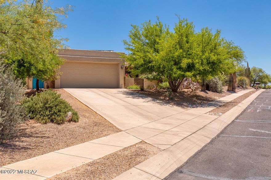 This beautiful, resort-like treasure is nestled in a quiet mesquite bosque near the Isabella Lee Nature Preserve. The home features an open floor plan with a split bedroom layout, to include a den/office. Energy efficient with a 26-panel Panasonic Solar Electric System. The home features arched doorways, decorative wall niches, Italian porcelain tile throughout, and a fireplace lined with a solid mesquite-wood mantel. The exquisite gourmet kitchen is equipped with Bosch appliances, an over the range pot-filler, gas cooktop, SS hood vent, SS microwave, oven, and refrigerator. This one-of-a-kind kitchen features custom knotty hickory, soft close cabinets with crown molding, Dekton & granite counter tops, decorative tile backsplash, and breakfast bar. The owner's suite is generous in size with full access to the backyard through custom french-doors that span nearly floor to ceiling. Through the handcrafted and designed, antique, Belgian glass saloon doors, the ensuite bath has a large wheelchair accessible glass/travertine shower. The final touch to the primary suite is the custom closet designed specifically to accommodate any amount of wardrobe. The backyard paradise is bountiful with native plants and has a five-zone irrigation system. Adding wonderful color to the backyard is a custom built, gas-heated spool, finished in Bella Blue PebbleFina.