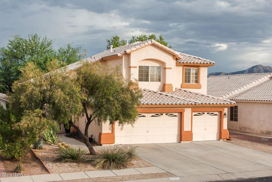Updated Continental Ranch Beauty!  Home boasts 4 bedrooms and 3 baths, tile and wood flooring, a great room off the kitchen, plus formal dining and living room.  The gourmet kitchen will impress with a concrete counters, deep farmhouse sink, and pendant lights.  The delightfully decorated stairs lead you to an upstairs loft with two bedrooms and the master suite.  The master bathroom is tastefully updated with separate tub and shower.  Outside you will find a gardener's dream with built-in planters, a large covered patio, and no neighbors behind.  Take a look at this charming home today!