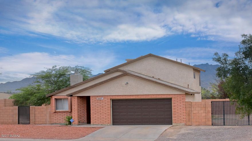 Great location close to I-10, schools, supermarkets & the Foot Hills Mall for additional shopping, restaurants & entertainment. Situated on huge lot w/RV parking allowed in backyard! Recently updated 1,453 SQ FT tri-level home features 3 bedrooms & 2 baths w/lots of upgrades including new carpet! Main entry level has large dining area w/wood burning fireplace & a gorgeous kitchen w/granite counter tops, solid wood cabinets, SS fridge, gas cook top & double oven. Living area, guest room, bathroom & laundry on lower level. Master, guest room & bathroom on top floor. Backyard w/covered patio, grass area & 30 amp outlet plug-in for RV. Backyard backs up to ravine & has block wall for lots of privacy. Community park w/basketball court right across the street! Call today for your private showing