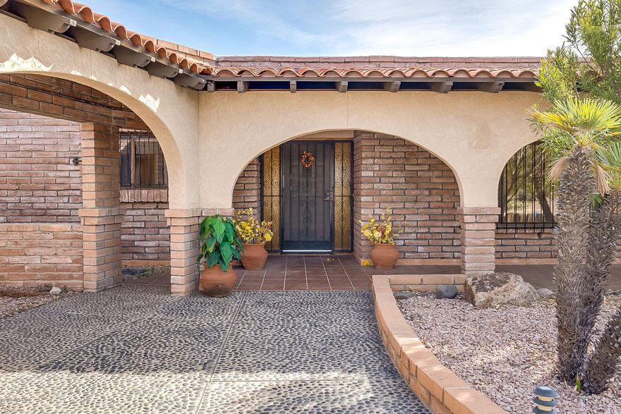 You won't believe it. Burnt Adobe home built in 1977 with 4 bedrooms, 3 bathrooms, 4 garages on over 1/2 acre with a pool and extended covered patio, mountain views on a cul de sac street. Nice private neighborhood and close to everything in the North part of town. One of the bedrooms is separate with it's own bathroom for privacy, could be used for guests or office. Updated eat in kitchen with breakfast bar and close to the family room with fireplace. Formal dining room and large living room makes this the perfect family and party house. Loads of storage including pantry and cupboards in laundry room. Large storage shed on cement off back yard for the toys that won't fit in the 2-2 car garages. Block wall with lots of room outside wall. Easy care front yard with paved circular driveway. Washer, dryer and frig included. Don't wait on this one. It will go fast.