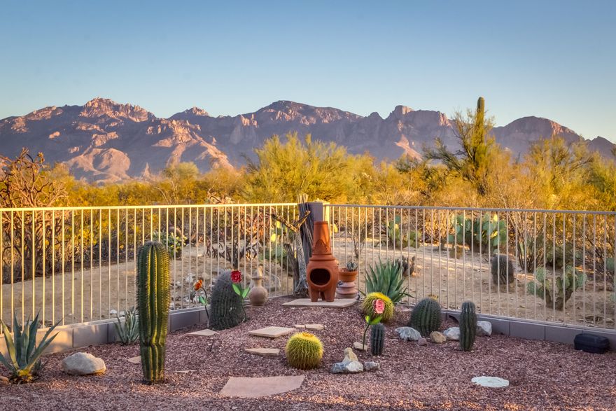 Gated Monterey at Vistoso- 1 story 3BR/2BA+den - private cul-de-sac premium view lot-no homes behind overlooking Honey Bee Park & Catalina Mountain unobstructed view. 2011 Kitchen remodel w/Quarter Sawn Oak Cabinets w/Pecan finish w/pull-outs, Granite counters, GE & Frigidaire appliances, pantry, breakfast bar. Family room off kitchen has fireplace. Formal Living/Dining area. Newer modern ceramic tile, newer carpet in MB. Master suite 2014 bath remodel w/new cherry wood cabinetry w/oak finish, Silestone counters, walk-in shower & walk-in closet. Enjoy east-facing patio w/mountain views from private backyard w/extended covered patio, Flagstone, Spool, Kiva wrought iron fence. Front security door. 3 car garage. Original owner, well-maintained, used as 2nd home. Furnishings negotiable.