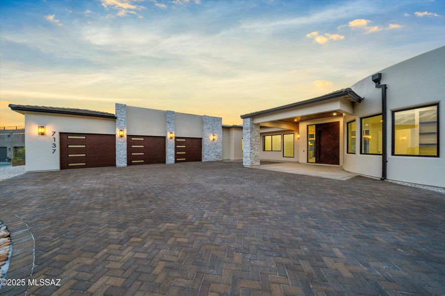 Experience ultimate luxury in this 2025 new construction home where modern elegance and thoughtful design come together seamlessly. Upon arrival, the striking contemporary architecture sets the stage for an unparalleled living experience. Bathed in natural light, this energy-efficient residence showcases premium finishes chosen with meticulous care to define contemporary luxury. The open-concept living space features a stunning gourmet kitchen with custom cabinetry, Taj Mahal countertops, an oversized waterfall island, top-of-the-line appliances, and an expansive built in hidden pantry it all serves as a culinary heaven where style meets functionality. Wall-to-wall sliders usher you to a resort-style backyard designed for exceptional indoor/outdoor living. Off the living area is an office space with custom storage cabinets soaring picture windows overlooking city & mountain views. The primary's wing also offers a space that can serve various purposes from a home gym, media room or a second home office, the primary suite is a serene retreat with soaking tub, oversized shower, beautiful lighting fixtures, and a spacious custom walk-in closet. Step into the backyard, an entertainer's paradise designed for relaxation and gatherings. This is your exclusive luxury resort offering complete privacy. A heated pool featuring a baja shelf, swim-up bar, sunken lounge with a firepit and ample sitting space. Minutes away from restaurants, golfing, parks and much more.