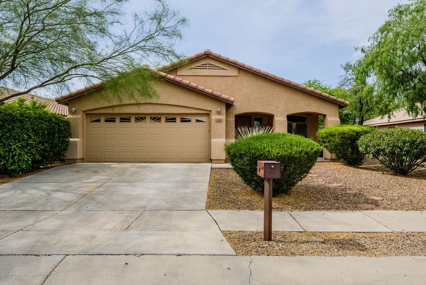 This home is absolutely immaculate and ready to move in!  Step into this 4bd/2Ba, 1727 Sq Ft quality Lennar built home in Mesquite Ranch in the coveted Vail School District.  Enjoy a formal dining area and living room, family room off kitchen that boasts all stainless steel appliances and a breakfast bar!  The home has blinds throughout, ceiling fans in all bedrooms jack and jill hall bath with marble vanity, master bedroom has dual marble vanity and a spacious walk in closet.  Washer and dryer included and the large back yard has a covered patio and plenty of room for entertaining! The neighborhood boasts 2 swimming pools, playgrounds and walking trails!! All of this is situated minutes from Houghton Rd shopping and dining, I-10, Raytheon, U of A Tech Park, Target Distribution Center, In progress Amazon Fullfillment Center, Pima Air and Space Museum, Tucson Airport and Davis Monthan AFB.  This will not be around long, come and get it!!