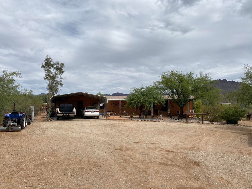 Wonderful 2 Bedroom 2 Bath Manufactured Home on 1 Acre of Beautiful Horse Property w/Gorgeous Sweeping Mountain Views, Riding Trails, Horse Facilities & More! This Great Property has Been Well Maintained & Updated! Nice Open Floor Plan w/Large Living Room, Dining Area, Beautiful Kitchen w/Brkfst Bar, Fridge Included, Newer Laminate & Carpet Flooring, Ceiling Fans in All Rooms, Master Suite w/ Big Master Bath w/Upgraded Shower, Inside Laundry Room, Newer 3 Ton A/C, Roof Recently Maintained, Full Length Front Covered Awning w/Colored Concrete, Great Back Covered Porch, 2 Horse Shade Buildings, Fenced Corral, Hay/Tack Room, Large 2 Car Carport w/Storage Workshop or Outside Laundry Rm, Fully Fenced Lot in a Great Private Location, RV Hookup & No Flood Zone! Come See Today!