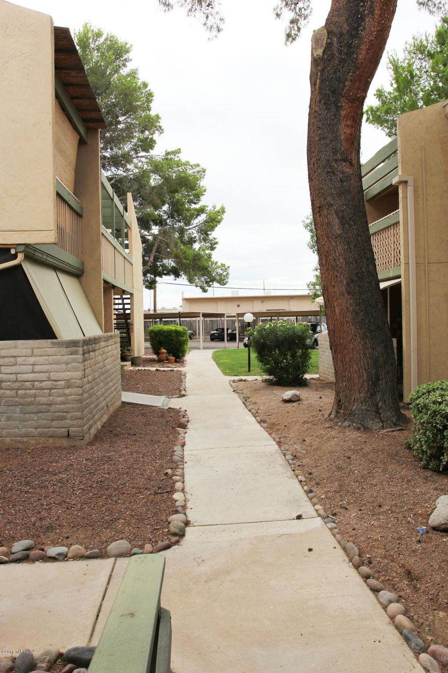 Completely remodeled!! Features tile flooring throughout. Kitchen includes black appliances & granite counters. Carpet in the bedrooms. Updated light fixtures, hardware & ceiling fans throughout. No interior steps! Covered patio off of living room.