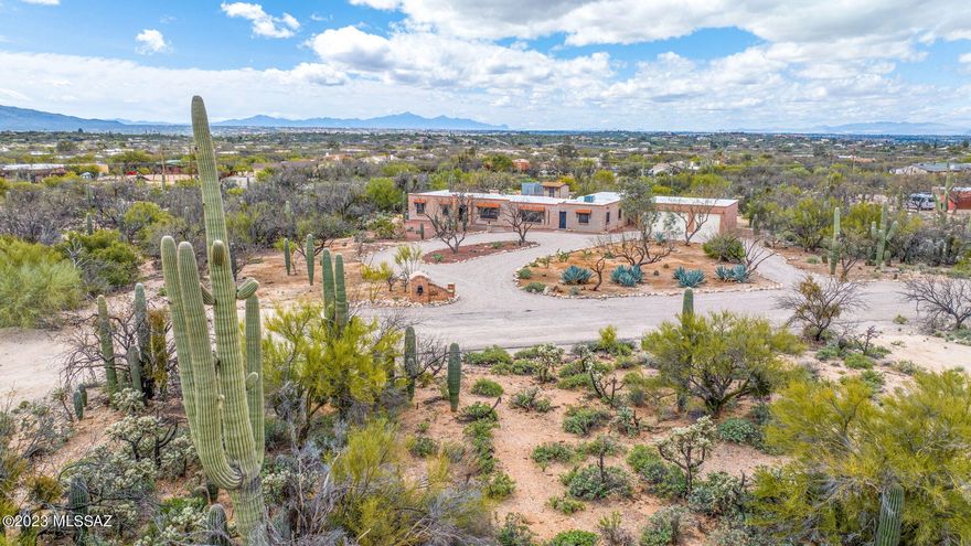 Vintage Northeast Foothills Tucson Home with 5 bedrooms, 3 baths and  an additional room for a home office.  This property has spectacular views of the Catalina Mountains!  Situated on a 3.41 acre parcel, the residence has a split  floor plan with three bedrooms on one end of the home and two bedrooms on the other. This Suite type orientation makes it perfect for a separate living area for family or visitors.  An oversized three car garage allows room for a workbench or hobby area. Outside storage building provides room for even more storage for off season items.  Fenced back yard is perfect for pets and/or a future location for a a pool.