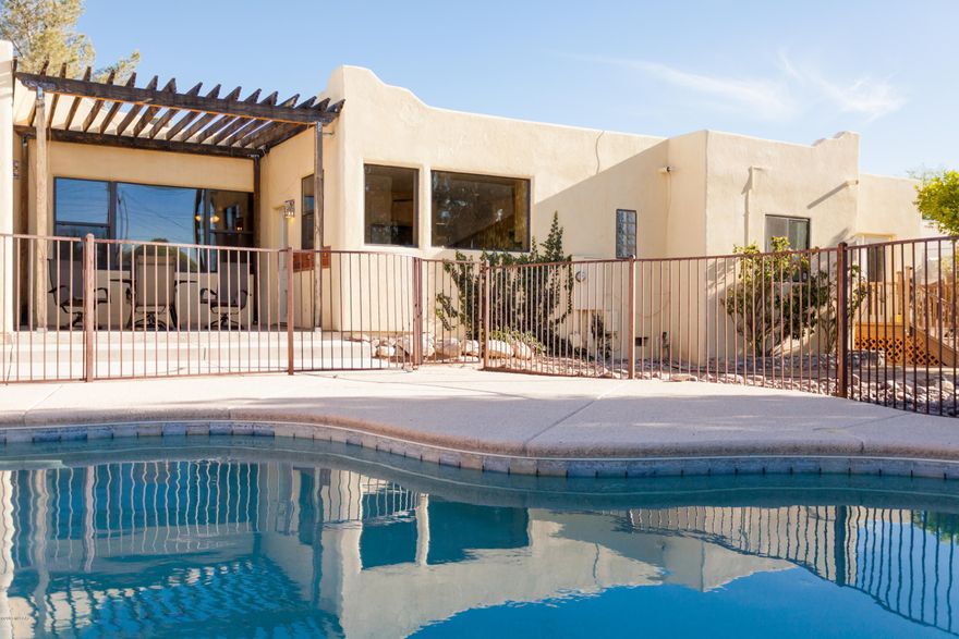 Highly Desirable Historic Sam Hughes neighborhood home.  Breathtaking views of the Catalina Mtns. Original hardwood floors recently refinished and Saltillo tile throughout the home.  Beautiful Hickory Cabinets and SS app. in the large kitchen.  Dual Telavara sinks and huge walk in shower with 4 heads in the Large Master Bedroom.  In 2017, the AC was replaced, roof recoated and hot water heater replaced.  Large den and best of all, beautiful sparkling Pool/Spa in the backyard for entertaining your family and friends. Just 2 blocks to 3rd St. bike path and easy walk to U of A, Himmel Park, Rincon Market, UMC and multiple restaurants TRULY A MUST SEE!!!