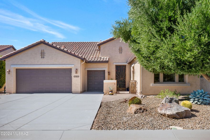 Welcome to this exquisite Pima model home nestled in the award-winning Saddlebrooke Ranch,  a premier retirement community.  This immaculately maintained property boasts a luxurious separate guest casita with a spacious walk-in closet and a fully upgraded ensuite bathroomperfect for hosting visitors in style.  Step outside and immerse yourself in the resort-like backyard,  featuring a luxury heated pool,  complete with travertine hardscape and a covered patio. The pool is heated by both gas and solar,  with fully paid-off solar panels ensuring energy efficiency and cost savings.  Entertain outdoors with ease using the built-in gas grill and relax by the custom gas fireplace,  recently upgraded with new insert components.  The covered patio has new outdoor ceiling fans for year-round comfort, and a raised herb garden adds a delightful touch of nature. The curb appeal of this home is undeniable, with a freshly repainted exterior, a newly resurfaced driveway, and recently installed rain gutters. The welcoming front courtyard, complete with a wrought iron gate, provides security and a stylish entrance. Inside, the kitchen is a chef's dream, featuring energy-efficient appliances, a large island, and granite countertops. Generous cabinet space with pull-out shelving and a reverse osmosis system at the sink ensure both convenience and sustainability. The great room is a showstopper with custom wood built-in cabinets, a surround sound stereo system, and an elegant TV console for your entertainment needs. The primary bedroom is bathed in natural light and showcases premium luxury laminate flooring, while the laundry room offers extensive storage and a utility sink. The garage has been extended by four feet and includes overhead storage, wall cabinets, a bike pulley system, custom epoxy flooring, and a well-serviced water softener. This home also features a dedicated office space with built-in shelving and cabinetsideal for a workspace, study, or library. The standout feature of this property is that every bedroom has an ensuite bathroom, providing ultimate comfort and privacy. Living in Saddlebrooke Ranch means enjoying world-class amenities such as golf, pickleball, swimming, and even a local brewery. Make this desert oasis your home and experience the finest in retirement living. Schedule your showing today!