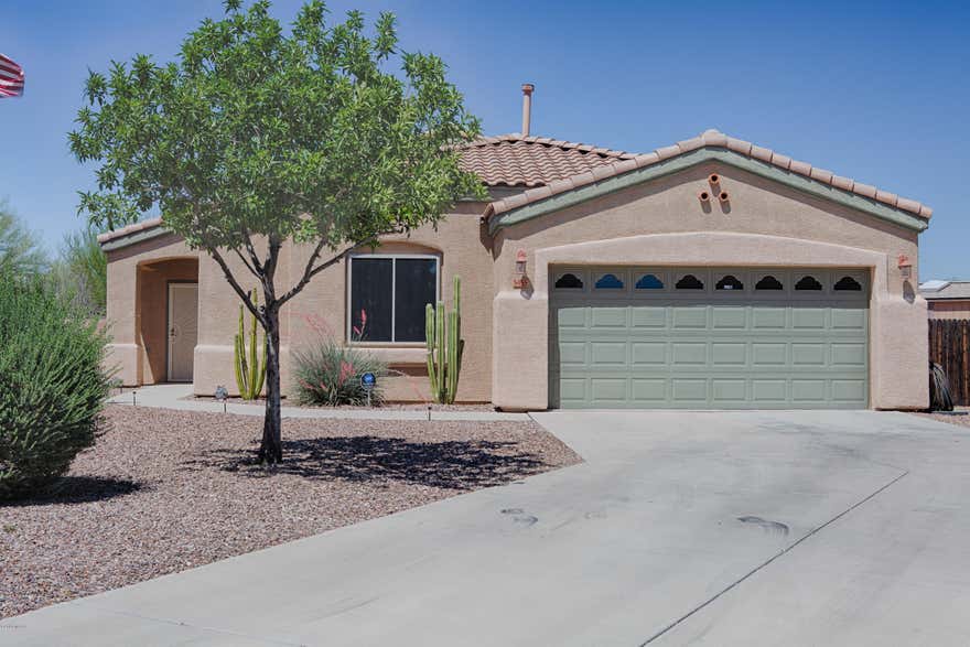 Amazing 4 bedroom located on private 1/3 acre lot. Backyard faces east w/ unobstructed mountain views.  Many brick pavers enhance backyard. Kitchen opens to great room, upgraded Cherry Cabinets, breakfast bar, black appliances stay, pantry and cabinets all have pullouts.  Split bedroom plan, Master bedroom w/walk in closet, MB w/separate shower, garden tub and double sinks. All tile except bedrooms.  One of a kind Pebble Tec Heated Child safe Pool & Spa w/waterfall. Lifetime Security Screens on all windows at a cost of $9500.  80 Gallon Solar Hot Water Heater. Water Tec water softener 2 years old. Exterior of home has been recently painted.  8X12 Tuff Shed remains. Double gate entry to backyard. Garage w/overhead storage. Home has been lovingly cared for by sellers.  Don't miss this GEM!!