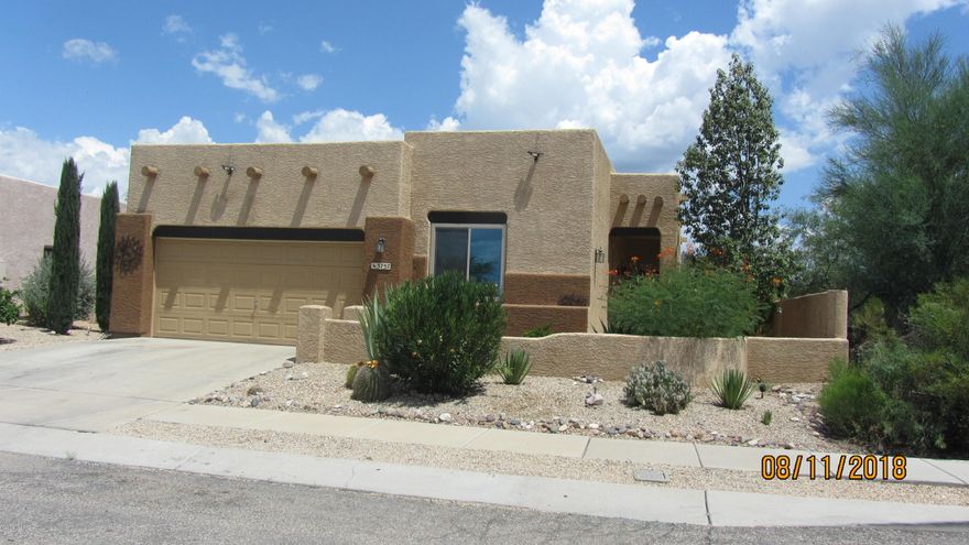 Santa Fe Style home is move in ready and shows pride of ownership.  Good size master bedroom with garden tub/shower, decorative gas fireplace in family room, alarm ready.  Extra bonus room with added doors for privacy could be a great office or bedroom.  Solar powered by Solar City.  Nice small subdivision with only 25 homes.  Great mountain views with lots of privacy in beautiful backyard, great for entertaining.  Home is on cul-de-sac and corner lot.