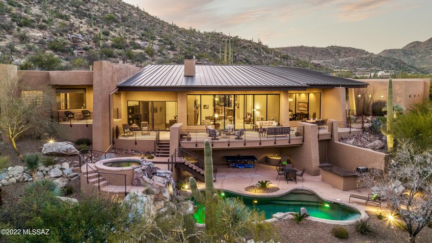 Enjoy the best of luxury living in this spectacular Canyon Pass home!  Plenty of privacy and stunning mountain views from the elevated hillside lot.  The home is 5008 sqft with a 585 sqft detached 1bd/1ba casita! Impressive massive windows and walls of glass bring the dramatic views in to you!  The gourmet kitchen features Dacor appliances, 6 burner stove, 2 dishwashers and much more. Great Room with wet bar and wine fridge. Living Room stuns with its wall of glass and amazing mountain views. Distinctive Master suite is spacious and luxurious. Expansive front deck overlooks the pool, spa and huge rock waterfall! 2 BBQ/bar areas. This home is perfect for entertaining and for taking in the amazing AZ sunsets! Enclosed dog run. 3 Car garage.