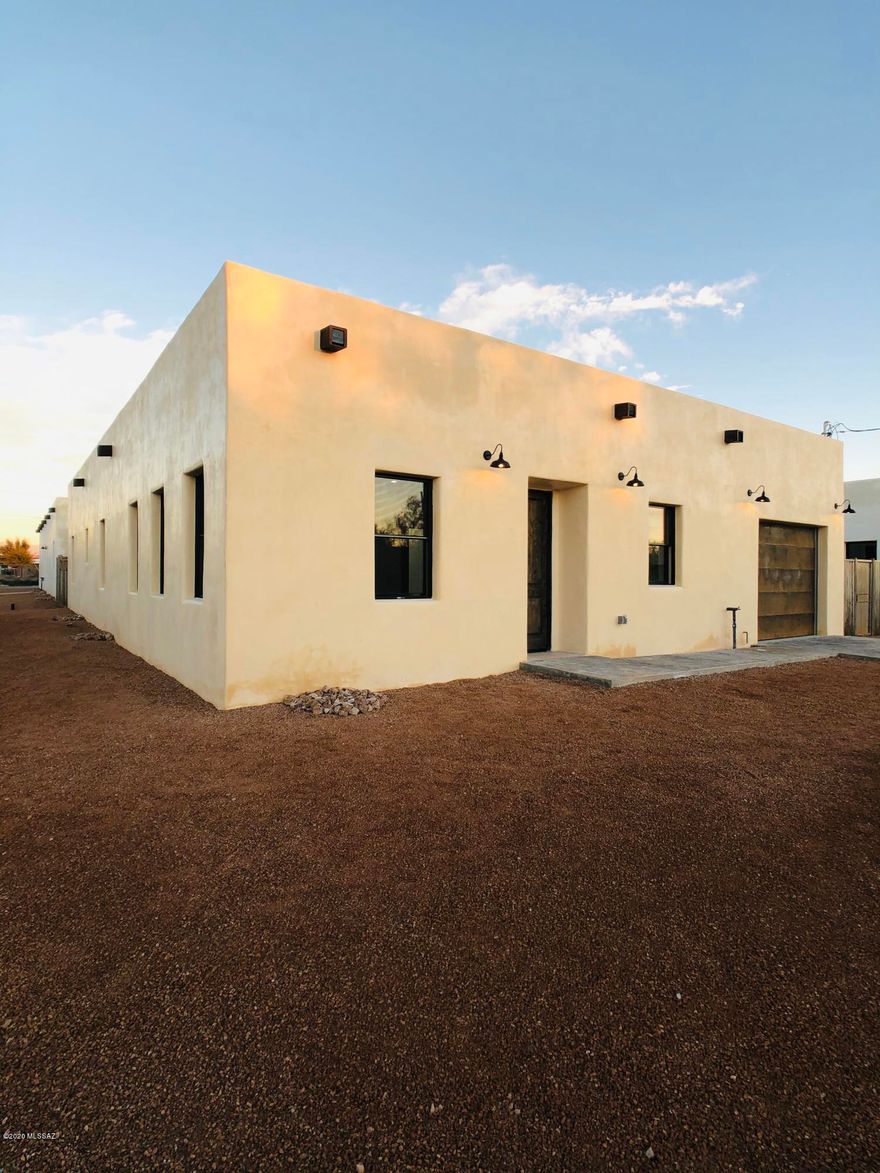 Here's your opportunity to own 1 of only 4 Beautiful Custom New Built Homes in one of Tucson's oldest Neighborhoods, Barrio Santa Rosa Historic District! This home was thoughtfully designed, creating a modern open floor plan with an abundance of double hung windows & vision panel doors making the most of ample natural sunlight, 10' ceilings & beautiful wood look tile thru out, Kitchen boasts Stunning light reflective Granite Countertops, a 9ft' Kitchen Island, 42'' solid wood doors/frame cabinetry w/soft close drawers, & trendy higher end polished chrome fixtures thru out! Bathrooms feature Timeless Elegant Marble Tile Wall to Wall & Floor to Ceiling! The Nest Learning Thermostat optimizes heating & cooling to conserve energy! Ceiling fans w/LED light & remote(s). 8 ft Knotty Alder doors & hand stained woodwork thru out! Custom Rustic Metal Garage Electric Door & Curragated Metal Fencing for privacy, Centered Quartyard to enjoy indoor outdoor living, Block Built w/smooth stucco synthetic paint finish. Must see to appreciate the Exceptional Quality & Workmanship thru out! Roof, A/C Warranties Transfer. Walking distance to 5pts Market & lively Downtown Tucson! Treat as Owner/Agent. Permits and Bldg Final Approved.