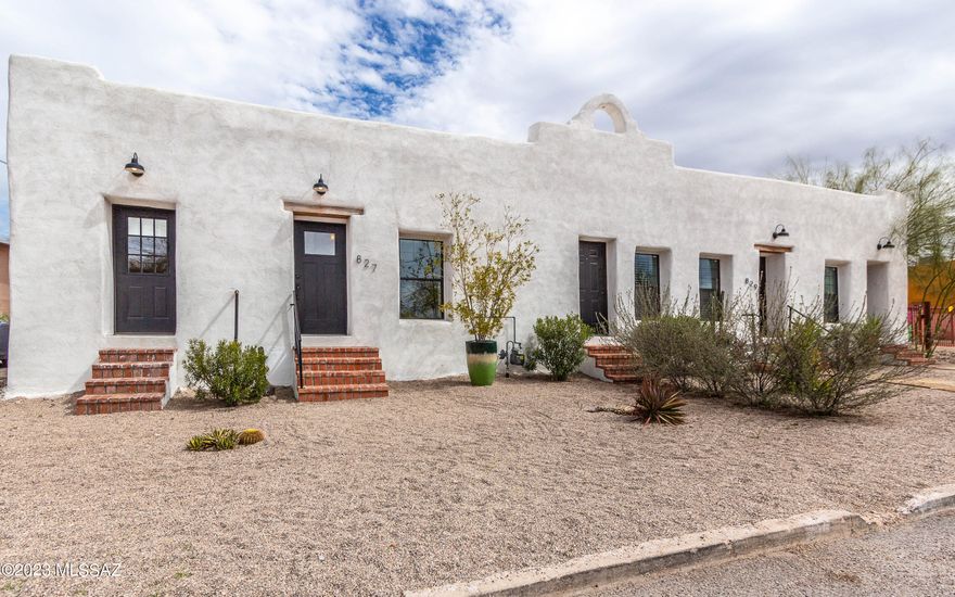 Beautifully restored historic Sonoran row house in Barrio Santa Rosa. Originally built in the late 19th-century, this home has been thoughtfully renovated to preserve its historic adobe charm while offering modern amenities. The huge kitchen has lots of counter space, a 5-burner gas cooktop, conv oven, walk-in pantry, lots of drawers & a big island. It's perfect for entertaining. The focal point in the primary suite is the rustic adobe. The room is spacious enough to include a sitting area, a walk-in closet, and a beautiful modern bathroom. Another bedroom has a separate entry. There's a big backyard & a 2-car garage, which is seldom found in the area. Located in the heart of Tucson's barrio, just steps away from the 5 Points area with lots of local restaurants and walkable to downtown.