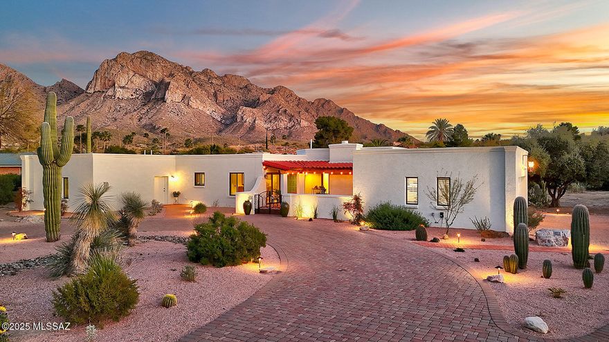 Nestled in the prestigious Oro Valley Country Club Community, this gorgeous Southwest-style home offers breathtaking mountain views on an incredible lot. Just moments from the Oro Valley Country Club—where members can enjoy golf, dining, fitness, and pickleball—this home combines luxury with an unbeatable location. A paver driveway and gated courtyard welcome you into a beautifully remodeled interior, featuring new tile flooring, doors, lighting, and windows. The stunning kitchen boasts rich Alder cabinets, granite countertops, and stainless steel appliances, complemented by a newly designed butler's pantry with a dedicated coffee and wine area. A spacious flex room provides endless possibilities for living and entertaining, enhanced by a recently added fireplace, custom entertainment center and a third bathroom. The living room's focal point is a striking fireplace, framed by custom mosaic tiles and a newly crafted mantel. Retreat to the expansive primary suite, complete with a spa-like bath and a generous walk-in closet. Step outside to a backyard oasis, where you'll love entertaining under the large ramada, taking a refreshing splash in the heated pool, and soaking in the stunning desert landscape with yard lighting and panoramic Catalina Mountain views. Additional upgrades include HVAC units, fresh interior and exterior paint, a custom mailbox, a new water heater, and a natural gas connection. This remarkable home is a true Southwest gem!