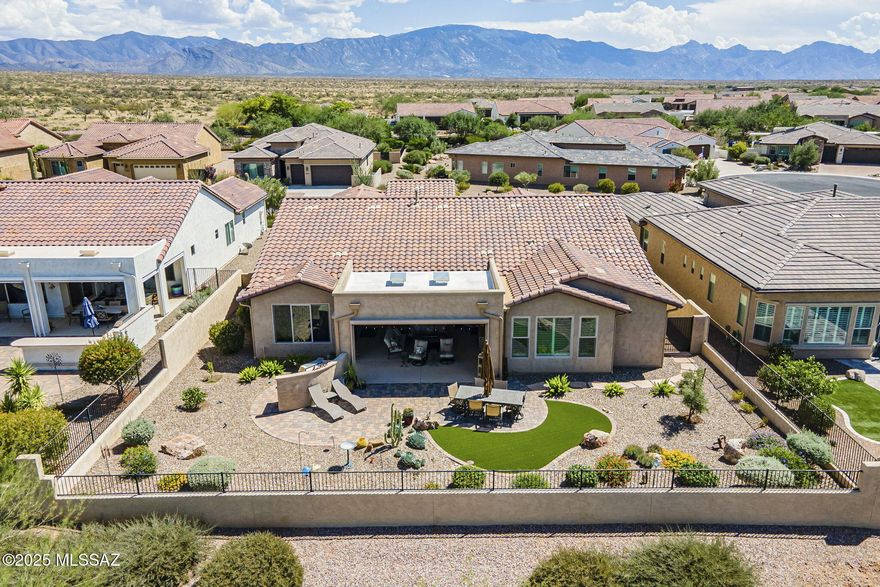 Tesoro floor plan w/casita in SaddleBrooke Ranch, active adult community with world-class amenities. Built in 2018, this 2,904 SF home backs to the Tortolita Mountains w/golf course views in the distance. Featuring 3 bedroom suites, large den, & powder room, designed for comfort and entertaining. Chef's kitchen boasts quartz, SS appliances, gas cooktop, dual ovens, built-in fridge, butler's pantry, walk-in pantry, and large island. Great room offers a custom entertainment center and bar w/wine fridge. Primary suite includes dual vanity, glass shower with bench, and spacious walk-in closet. Casita has cabinets, wine fridge, sink for guests. Extended garage, laundry with storage, zoned HVAC, and expansive patio with retractable screens, BBQ, turf, and pavers complete this stunning retreat.