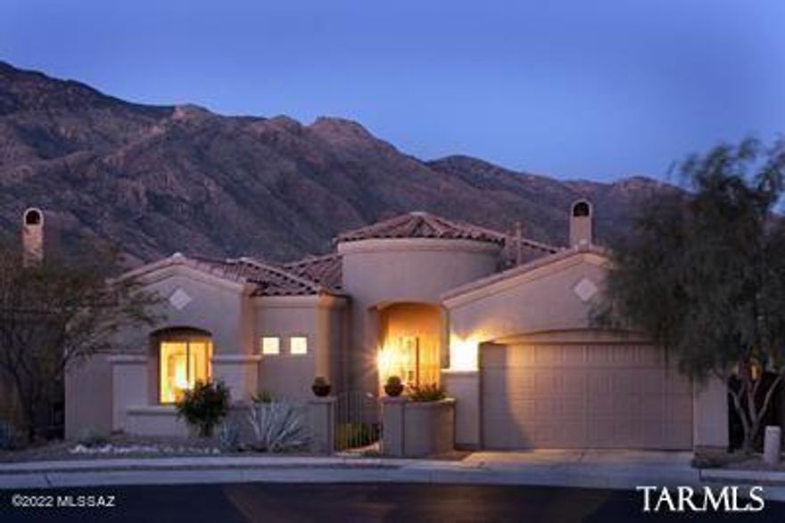 Once owned by the most loved and respected man in Tucson, Hall of Fame & former Univ of Ariz men's basketball coach, Lute Olsen, this stunning A.F. Sterling home built in 2005 sits on arguably the best lot in this coveted La Paloma enclave. As you approach, you are welcomed by a courtyard entry, landscaped beautifully with exotic specimen cacti and colorful native plants. The custom front door leads you into the entry foyer where your eyes will be immediately drawn to the large picture windows framing the lush fairways and towering Catalina mountains in the foreground. The stunning and inviting living room features designer window treatments and a stacked stone gas fireplace. The gourmet kitchen features granite countertops, newer appliances, a breakfast bar and casual breakfast area. The dining room offers magnificent views, a custom built in buffet and custom mesquite floating shelves. The luxurious owner's suite features a built in entertainment center, French doors leading to the rear terrace and a spa like bathroom w/jacuzzi tub, walk in shower and customized walk-in closet. Other notable interior features include 8' solid Alder wood doors, designer paint, powder room and a split bedroom floorplan.  Outside is an entertainers dream patio located on the 2nd tee box of the Canyon Course; a signature Jack Nicklaus Designed Golf Course. Entertain your friends with a good joke or a cold beverage as they make the turn or critique the backswing of other golfers as you watch from your built-in outdoor grilling station or as you sit by the beehive fireplace with evening cocktail in hand. Professionally landscaped, the patio is inviting and spacious yet low maintenance making this home an ideal "lock and leave" vacation home. This home has been extensively upgraded, updated and very well maintained and has always been a 2nd home since new. A Prime Foothills Location, in a coveted Gated Country Club, built by a respected builder on a Superb Golf Course Lot combined with Exquisite Finishes & Attention to Detail second to none make this home the epitome of Luxury Foothills Living.