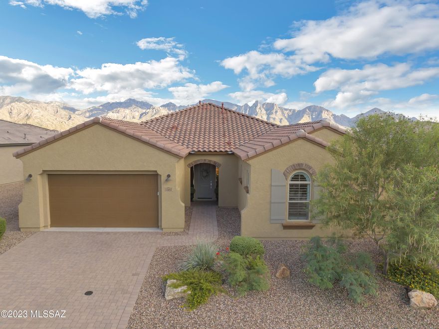 Start making your memories in this fantastic 4-bedroom 3.5 bath home with magnificent Catalina Mountain views! You will enjoy the wonderful open floor plan featuring a welcoming entryway, great room, kitchen, and dining area all with soaring ceilings.  The extra-large kitchen social island, with granite countertop, and the dining area, with extended cabinetry, is perfect for entertaining family and friends.  The spacious master suite features an ensuite bathroom with large walk-in shower, soaking tub, and a double vanity.  The extra-large master bedroom walk-in closet also features a direct entry to the laundry room offering real convenience.   Bedrooms number 2 and 3 include walk-in closets and a connected bathroom with two septate vanities and a shared walk-in shower. Bedroom number 4 includes an ensuite bathroom with a tub / shower combination.  There is also a half bath just off the entry for your guests.  When you step out of the back of the house through the 12-foot sliding doors you open up your own personal resort with a large covered patio overlooking the beautiful and refreshing pool.  The pool deck area features plenty of room for lounge chairs, dining table, and a built-in natural gas fire table for enjoying the amazing mountain colors at sunset.  The extended two car garage has plenty of space for all of your toys and the stop and drop cabinets in the entry to the garage round out the plentiful storage throughout the home.
