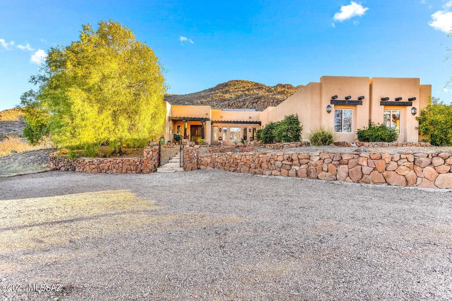 Welcome to 1057 Morning Star Ranch. This three bedroom three bath home offers rural ranch style living in luxury style. With the exposed wood vigas and post, granite countertops, Hardwood cabinetry and flooring along with an open floor plan offers a Sanctuary in the desert. This property offers two master suites, great for my family or the occasional guest. Outside, you will find the Beautiful pool and hot tub, with magnificent mountain views. The space is great for entertaining, or finding your center and quieting the noise around you. The tranquil natural desert Surroundings in the gated community of Morning Star Ranch allows you to enjoy 36 acres of optional horse property in privacy and security. The detached extended two car garage, attached workshop, and covered RV parking allows you to tinker, Workout or work on your favorite toys in comfort. When you are done you can retreat to the included infrared sauna for relaxation and rejuvenation. With solar and an energy efficient package, you will be able to enjoy all of this luxury without breaking the bank.