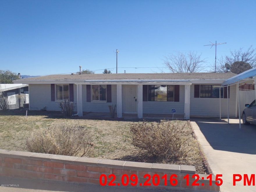 Nicely cared for 3 bedroom 2 bath home with a detached garage in rear and a carport in front.  Home has a den off the living room, a nice Arizona room in the back and is ready to move into.  Home has a water feature in the rear yard and the whole home is nicely landscaped.  Property was built prior to 1978 and lead based paint potentially exists.