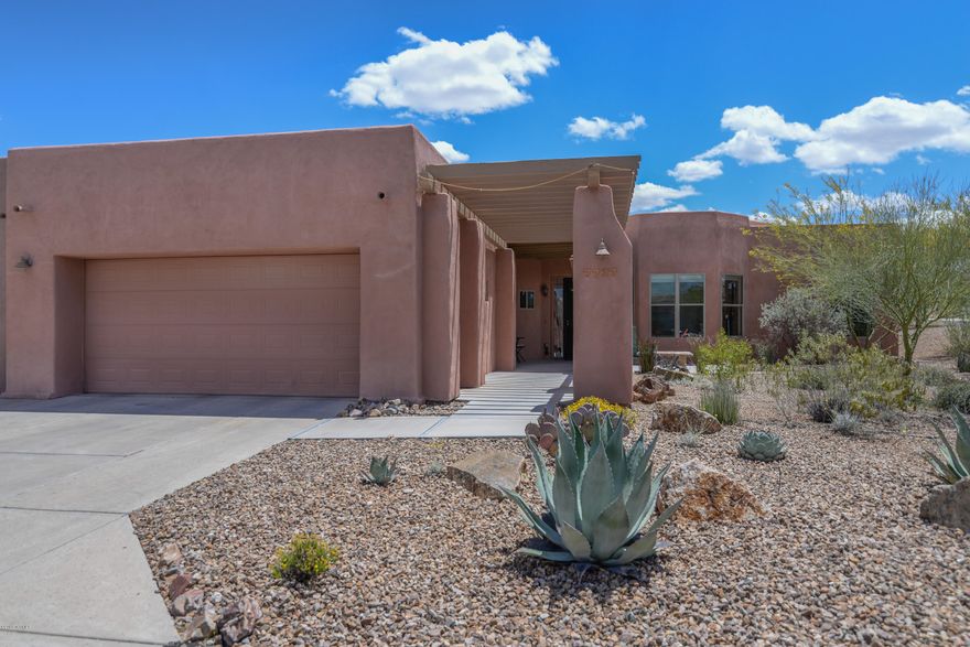 IT'S QUIET OVER HERE! Beautifully maintained solar powered home with views! Super desirable Palo Verde floor plan on a premium quiet lot with 2 bedrooms and a large den. High ceilings and big view windows capture the views.  Upgrades include an oversized patio, 3.5KW solar system, solar window screens, solar light tube in kitchen, wrought iron view fencing with 'rabbit proof' wire, wired for stereo, custom colors, and lots of tile flooring.  This active 55+ community has a year round heated pool with hot tub, tennis, extensive fitness programs, wellness center, plus outstanding concerts, lectures, classes, and social events via the Arizona Senior Academy. Seller would consider a lease back for several months.  Small fountain near front door does not convey. No loud cattle guard road noise!