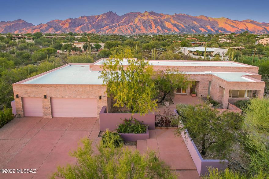 Spectacular mountain & sunset view home in gated Bellas Catalinas Estate. 4 BR/3BA, 3725 sq ft home w/open floor plan is perfect for casual living & entertaining. A warm contemporary masonry custom home. Soaring ceilings, Walls of glass brings the outside in. Concrete floors/countertops & custom cabinetry throughout. Kitchen has island w/ sitting and a Sub Zero. Primary bath boast a jetted tub, grand walk-in closet. Additional adjoining lot included for a total of 1.74 acres! Plenty of room to add a guest house if desired. A studio or 4th bedroom in separate wing with front courtyard access could make a great office. Oversized 3-car garage includes additional storage room, built-in storage rm @ 3rd bay, built-in cabinets w/sliding door access to covered patio is great for hobbies. Home designed by Donald Kornberg. LA related to Seller.