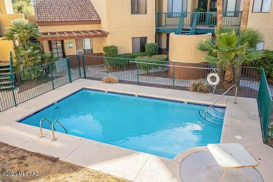 RENOVATED 2 bedroom and 2 bathroom 2nd floor condo overlooking the community pool, in the popular midtown Park Place Village Condos on Country Club. You will love the vaulted ceilings here, the living room features a wood burning fireplace and an abundance of natural light. The light and bright kitchen has Granite countertops, S.S. appliances, plenty of storage and access to the back private balcony with mt. views. The spacious split-bedroom open floor plan offers large walk-in closets and en-suite bathrooms with shower & tub. The condo also features a laundry closet with washer and dryer included. Great neighborhood near the Tucson Racquet & Fitness club, the Loop Trail, and Rio Vista Natural Resource Park. Convenient to the U of A, plus dining and shopping and transportation.