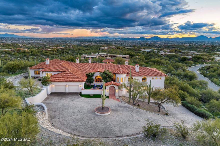 Step into a world of timeless sophistication and refined elegance, nestled within the prestigious small gated community of La Puerta, where this exquisite Santa Barbara-style estate awaits. Crafted by renowned builder Michael Wachs, this residence stands as a testament to unparalleled craftsmanship, complemented by its distinctive Mission tile roof and notable masonry construction.

Perched atop a sprawling hilltop lot spanning on 2.192 acres, this home offers unrivaled privacy and breathtaking 360 degree panoramic city and mountain views. Enjoy the serenity of your own private paradise, complete with a sparkling pool and spa overlooking the stunning city vistas that stretch as far as the eye can see.

The interiors boast expansive living spaces that provide ample room for both relaxation and entertainment. Interior features include: formal living and dining rooms, gourmet kitchen with an enclosed outdoor bbq and dining area, a family room, library, study/office, and private guest quarters. There are 4 gracious bedrooms, each with en-suite bathrooms and walk-in closets.  Indulge in the warmth of six inviting fireplaces, while rich wood floors and beamed ceilings add timeless charm and character throughout. The 5-car garage with generous storage space ensures convenience and security for your vehicles and belongings.

Welcome to your own private sanctuary, where every moment is infused with beauty, elegance, and refinement.  School district 16.

Schedule your private viewing today!