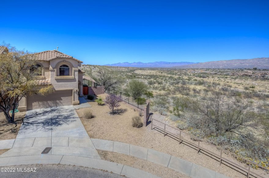Welcome to this beautiful Rancho Del Lago home on a cul-de-sac lot with STUNNING VIEWS!! Featuring 1,904 sq.ft., 3 Bedrooms PLUS a Loft, 2 full Bathrooms with a Powder Room downstairs, a Living Room with soaring ceilings and a cozy Family Room off of the Kitchen, this home is sure to exceed your expectations!  The Kitchen boasts of granite counter tops, island/breakfast bar, and black appliances including the refrigerator! The Primary Bedroom with en suite bathroom features 2 closets, dual vanity and walk-in shower.  New A/C in 2019! Venture out back to experience the EXPANSIVE MOUNTAIN VIEWS from the private covered patio or extended paver seating area, overlooking the Pantano Wash.  Close to shopping, dining, schools and recreation, the location is unbeatable!  Schedule your tour today!