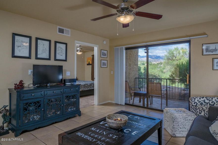 Private renovated ground floor condo with amazing Catalina Mountain view in the gated Northern Tucson community of The Villas At Sabino Canyon. This spacious Catalina Foothills condo features ceramic tile flooring everywhere except bedrooms, East facing covered patio with breathtaking views, split bedrooms, romantic wood burning fireplace, kitchen with custom cabinets, granite counters and stainless steel appliances, ceiling fans in both bedrooms and resort style amenities. The Villas At Sabino Canyon include a heated pool & spa, exercise facility, park-like grounds and a convenient location near shopping, restaurants and Sabino Canyon Park.