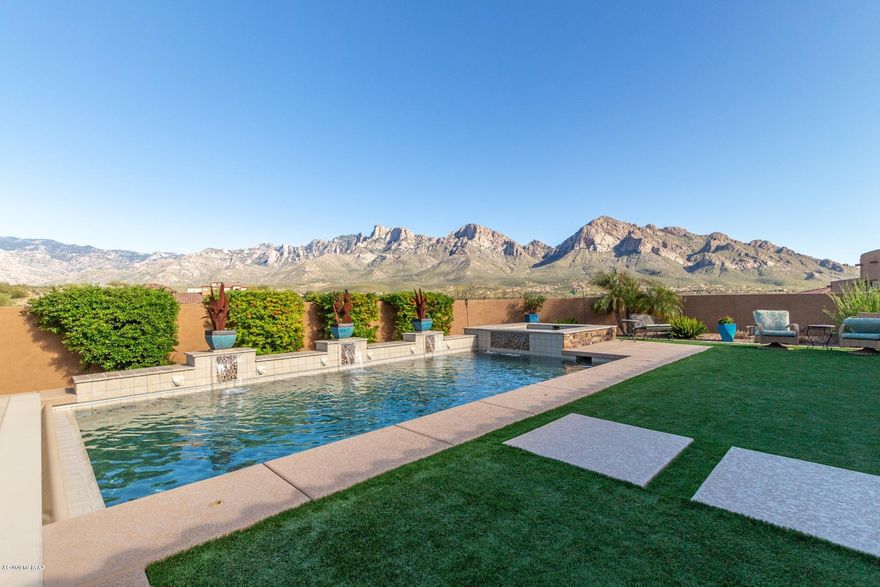 Breathe taking views of Catalina Mts. from almost every room. Gourmet kitchen boasts double dishwashers,  burner gas stove,prepping station, walk in pantry, wine fridge.quartz counters.  Entertain in your huge great room looking out at your resort backyard.  Large outdoor kitchen, salt water pool & spa. Radiant heaters in the ceiling of patio. Home is fully automated and surround sound in every room.3 bedrooms plus den. Master suite w/ custom walk in closet.  Master bath has double vanities, lg walk in shower.  Split bedroom plan with guest bedroom /private bath. 3rd Bedroom has Murphy bed. Oversized 3 car garage.