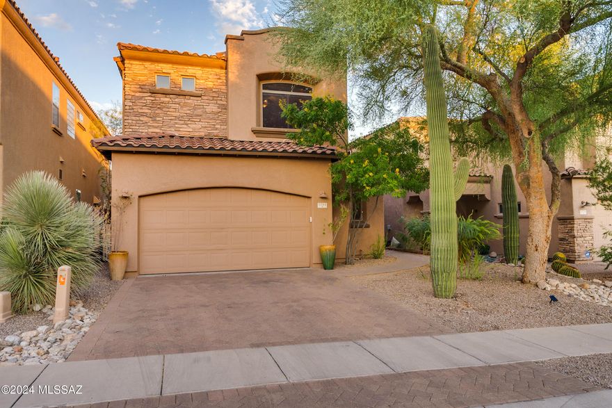 Welcome to this exceptional home located on a premium lot in the prestigious La Paloma Golf Course community, where breathtaking views of the surrounding mountains, lush fairways, and twinkling city lights await you.
This thoughtfully designed home features a rare floorplan with 3 bedrooms and 4 bathrooms, including two primary suites. One of the primary suites is conveniently located on the main level, offering two walk-in closets and direct access to the back patio. Each bedroom includes its own en suite bathroom, ensuring privacy and comfort for everyone.

The open kitchen boasts beautiful granite countertops, stainless steel appliances, and a convenient breakfast counter, perfect for casual dining or entertaining. It flows into the expansive great room with soaring ceilings and and oversized windows that flood the space with natural light, creating a bright and airy atmosphere.

Upstairs, you'll find the second primary suite, ideal for families, in-laws, or guests, along with a versatile loft area that offers the perfect space for a home office, reading nook, or secondary living area. Situated in a secure, gated community, this home combines elegance, modern living, and tranquility, right in the heart of La Paloma.  Owner is a licensed real estate professional